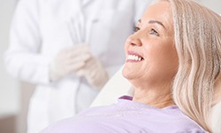 woman smiling after getting dental implants in Dallas