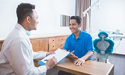 patient talking to dentist 