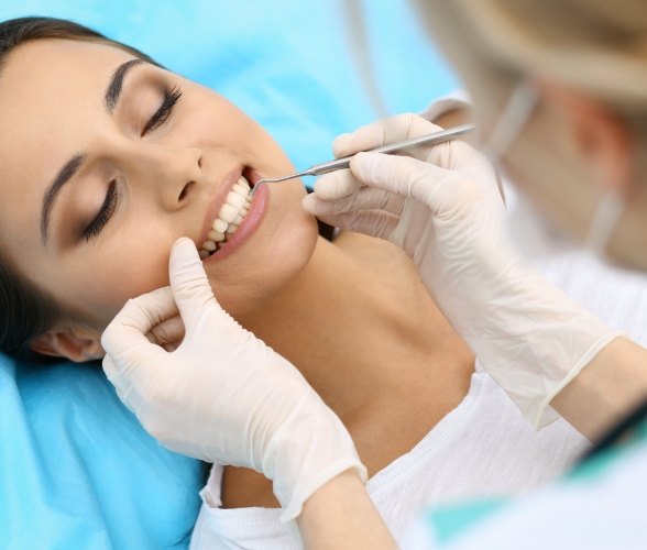 Woman receiving cosmetic periodontal surgery
