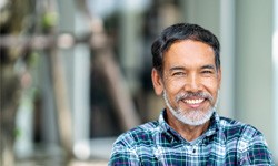 Man smiling with dental implants in Dallas