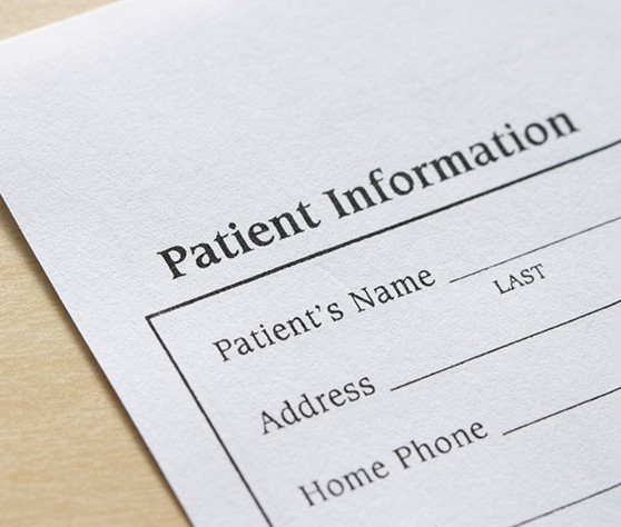 Close-up of patient information form on tabletop