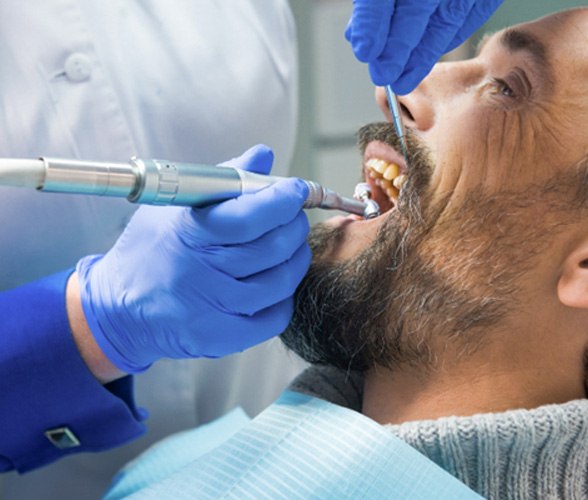 a man having his teeth cleaned by a periodontist
